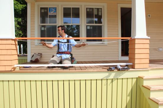 Holding the sub-top-rail in place to check the fit.