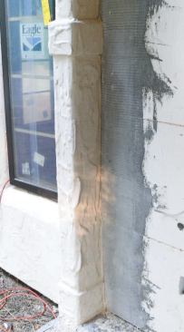 Base-coat application can begin after the foam has been leveled with a rasping board and abraded with a grit-welded float. Inside and outside corners get a double thickness of reinforcing mesh bedded in the base coat.