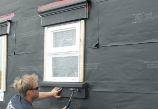 I then nail on the sill; at this point the window is ready for siding installation.