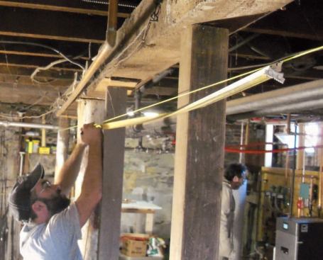 I measure along the string in 6-foot increments and mark off the centers of the new footings with a Sharpie.