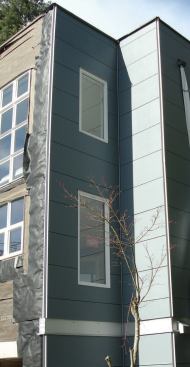 Horizontal panel joints are continuous around the building; panel layout was designed to avoid easily broken narrow rips above or below the windows.