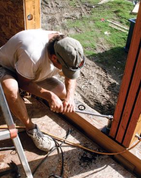 The stiffeners were bolted to the glulam and recessed into the wall panels.