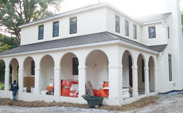 Corbels and other architectural details can be added to EIFS cladding by gluing foam profiles to the EPS before applying the base coat and finish. Areas that don’t require insulation, like the columns supporting the arches on this home, can be wrapped with cement backerboard instead of foam, which gives them better impact resistance.