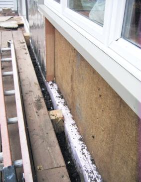 The perimeter of the slab-on-grade addition was insulated with two layers of 1 1/2-inch extruded polystyrene.