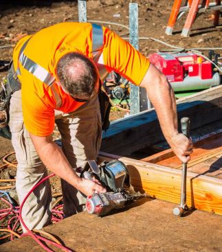 We like using coil framers because they hold more nails which decreases the downtime of reloading. We have two 
Max HN90 high pressure coil framing nailers that have been very reliable. They are light, powerful and never break down. We replaced one seal on one of the guns and that’s all the maintenance we’ve done. Despite the wear on the outside, when the tool was opened up the inside was extremely clean—an indication that the internal filter really did its job.