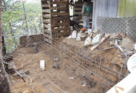 Heavy steel bearing plates welded to the tops of the piers support a beefy rebar cage, which has been spot-welded to the plates.
