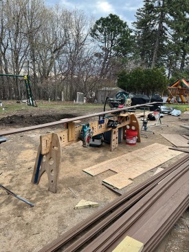 For deck work, the author configures the workstation to support long material. 