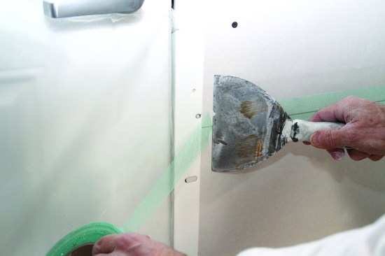 All fiberglass-mesh tape gets applied over a dry seam. This can save time because it eliminates the step of pressing the tape.