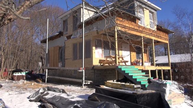 The house in January. In this view, the foundation underpinning is complete and the floors, walls, and roof have been jacked into shape and reinforced.