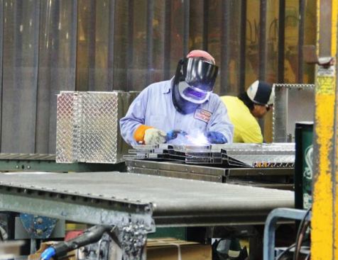 After the Saddle Box comes out of the fixture a human welder completes the welds the robot can’t do.