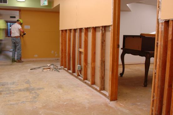 On interior walls, wet drywall is removed on both sides.