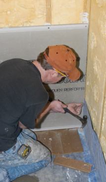 Once the mortar in the base set up, I finished the job by installing Durock cement board on the walls.