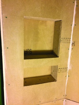 Shelves can take up space in the shower, so the tile installer created recessed nooks in the shower wall instead.