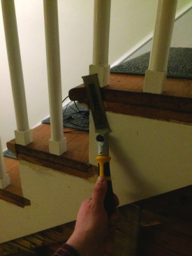 The first step was cutting off the stair treads flush with the skirt board where they hung out into the hallway.