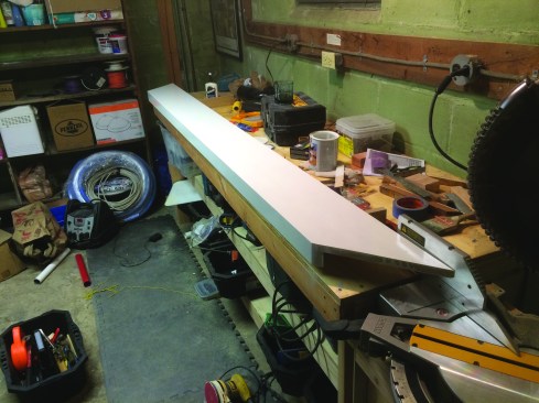 To maintain code-required clearance for the handrail on the stairway, a skirtboard was fabricated with a 2-inch horizontal cap.