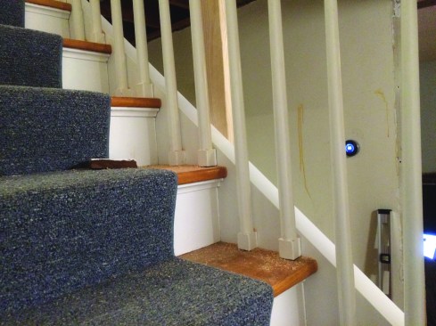 The photo shows the modified skirt board attached to the stairs. The framing for the bathroom wall would attach to the horizontal cap on the skirt.