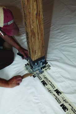 Once the poly was down, it was sealed to the columns using waterproof tape.
