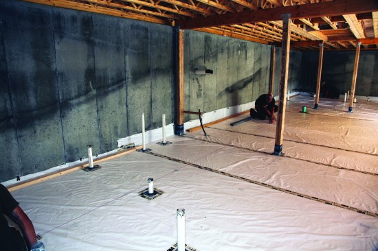 When the poly sheet was completely installed and sealed, the crew snapped a line 54 inches from the back wall of the foundation.