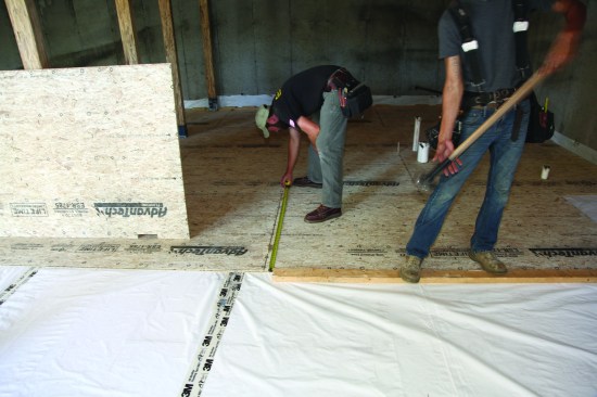 The rest of the courses then went in, with the crew measuring carefully to maintain proper spacing between sheets.