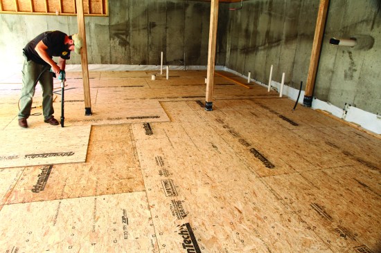 The second layer of subflooring was installed perpendicular to the first in a pattern that maintained double overlapping seams.
