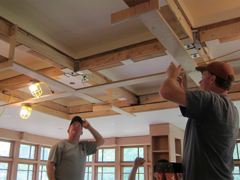The assembled sections of trim were lifted onto site-built plywood hangers.