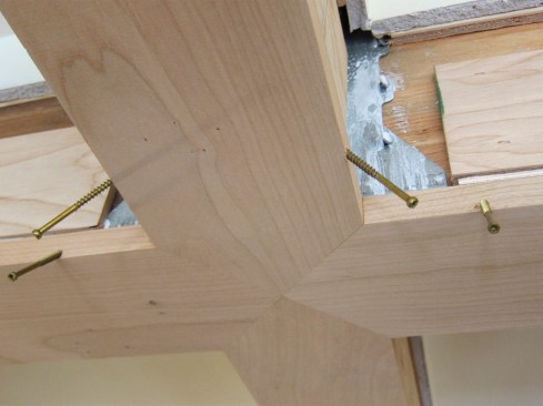 With the trim in place, the 1x5 cherry was then blind-screwed with trim-head screws to the beams.