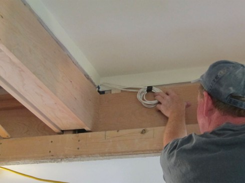 Low-voltage wiring was tacked up clear of the top cap, ready for connection to the LED lighting.