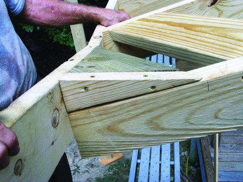 At the low end of the valley, the subfascias of the two roofs are mitered, with a block filling in the roof framing.