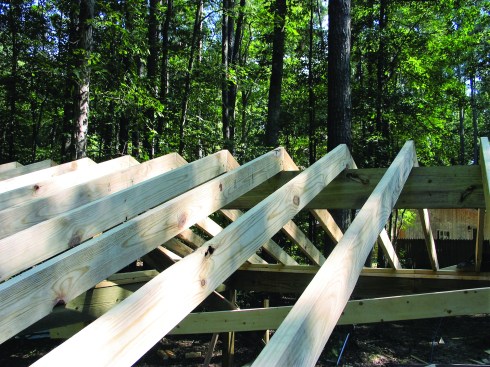 The gable roof on the porch addition was framed with a dropped structural ridge supporting the common rafters above.
