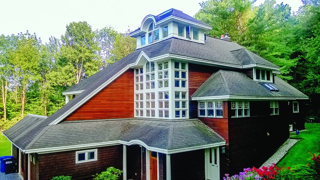 The house had been remodeled with complex architectural details, which made adding to the roof’s thickness impractical.