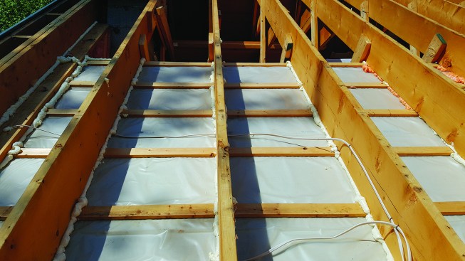 For this rehab, the existing ceiling was left in place, and the roof upgraded from above.