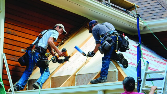 They protected the insulation with lauan plywood, also creating an air space to help cool and dry the roof system.