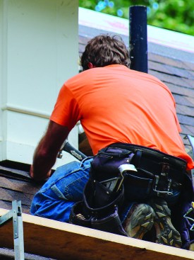 Where roofs abutted walls, the crew installed Cor-A-Vent Roof-2-Wall vent to allow air in the rafter vent channels to exit the system.