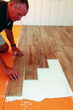 As the author pressed each tile into place, he pushed it side to side about 1/2 inch.