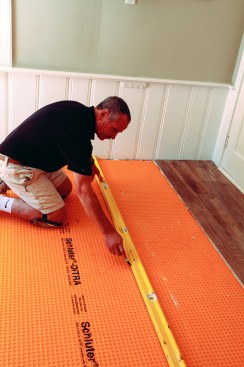 The second four-course section was laid out like the first, with a wall-to-wall guideline using the measurement from the initial dry layout