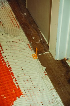 Then, as he bedded each tile into the thinset, he inserted a flat, 1/8-inch spacer at each grout-line intersection.