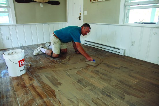 The author applied the grout initially with a rubber-edge grout trowel in sweeping diagonal strokes.