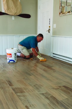 After letting the grout set up for a half hour or so, he went over the surface with a sponge and clean water, rinsing the sponge
frequently; this left a light haze on the surface.