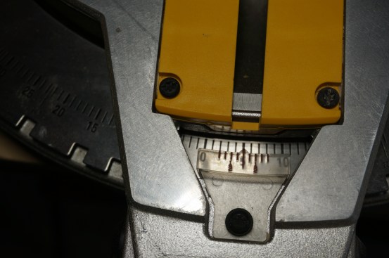 The first cut for a cope is along the straight line of the profile. The author sets the miter angle to 5° so that the cut slants away slightly from the edge of the profile. The back bevel ensures that no material will from the cut will prevent the joint from closing tightly.