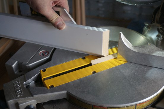 The first step to coping an inside corner is making a 45° angle cut on the end.