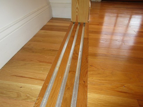 Here the three guide tracks are installed, spaced according to the manufacturer's specifications. 