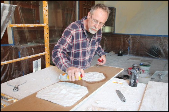 To help the plaster replacement pieces release easily from the mold, the wax impressions were first sprayed with cooking oil. Here, the backs of two wax pieces were sprayed in preparation to make mold saddles.