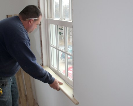 After applying the adhesive, set the stool in place one end at a time, taking care not to smear the adhesive where it will be seen.
