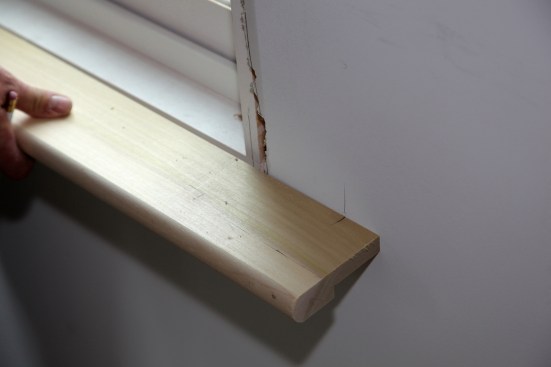 The layout for this side of the stool is complete. Note that this carpenter opted to notch the stool to step around the jamb. Jamb extension strips will be added after the stool is installed.