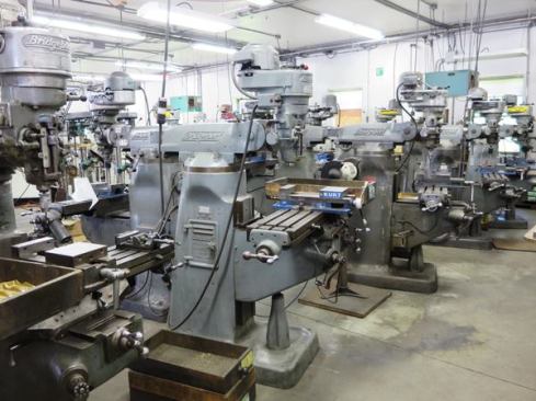 More old Bridgeport milling machines.