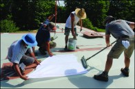 NDC crew members apply Acrylabs fluid-applied roofing to a 30-square roof located in New York’s Hudson River Valley.