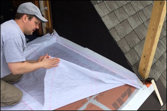 Before applying the Acrylabs tack coat, the reinforcing fabric was carefully cut to fit, then rolled up for later application. The fabric has a smooth side and a fuzzy side; the fabric is installed smooth side up.
