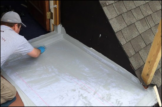 After the fabric has been carefully worked into the tack coat to smooth it out and remove air bubblesā¦