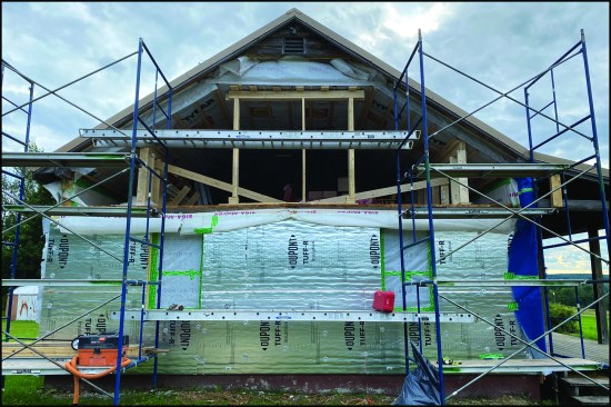 With the first floor framed and insulated, the upper east-facing gable end was opened up, ready to be infilled with the new wall components.