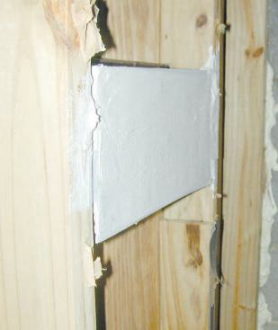To finish off the space, the author's crew seals the vent openings with duct tape and mastic.